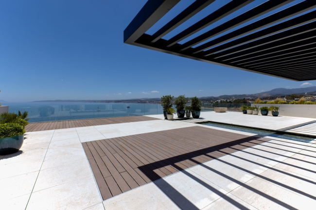 Discover the epitome of coastal luxury with this stunning Duplex-Penthouse in a prestigious front-line beach development in Estepona